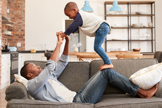 Man playing around with his son