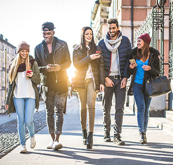 Group of young people walking down the street