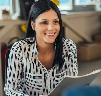 Woman in black and white shirt looking excited