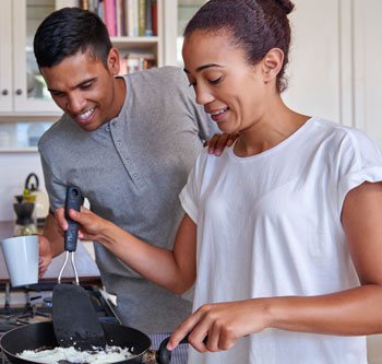 Happy couple cooking in the kitchen