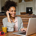 A woman doing digital banking on her laptop.