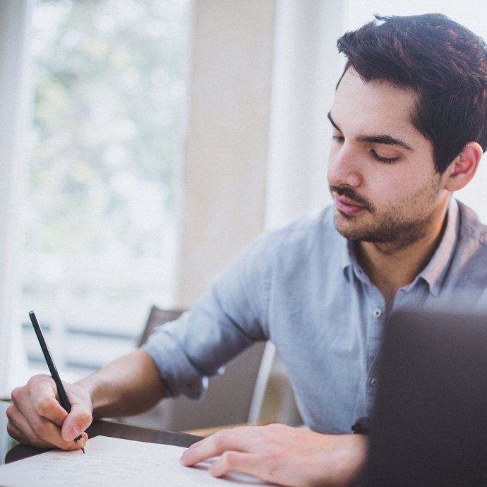 Man writing something down