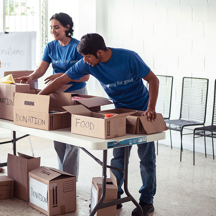 Two Broadview employees volunteering and organizing donations