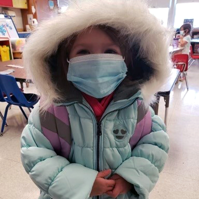 A little girl with a new winter coat