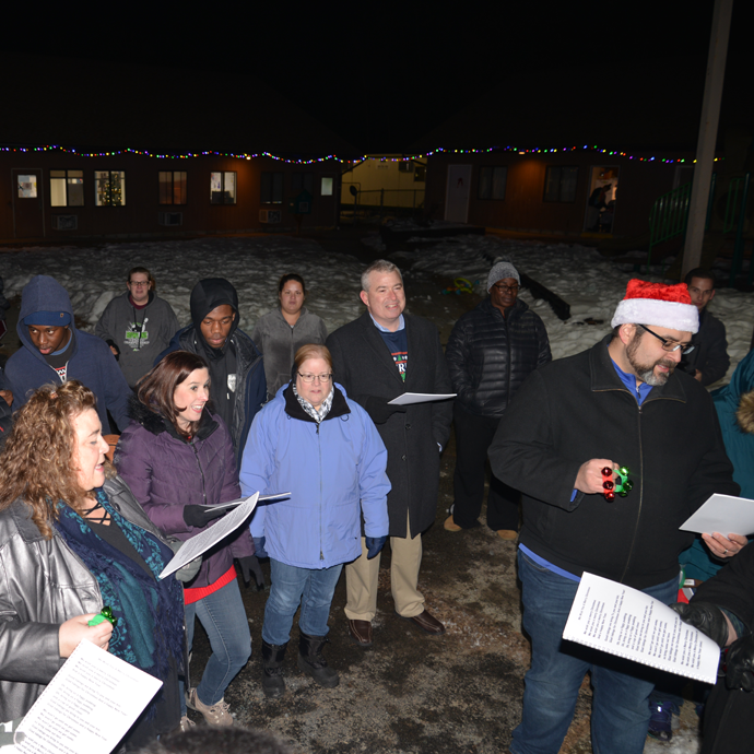 CAP COM volunteers singing holiday songs