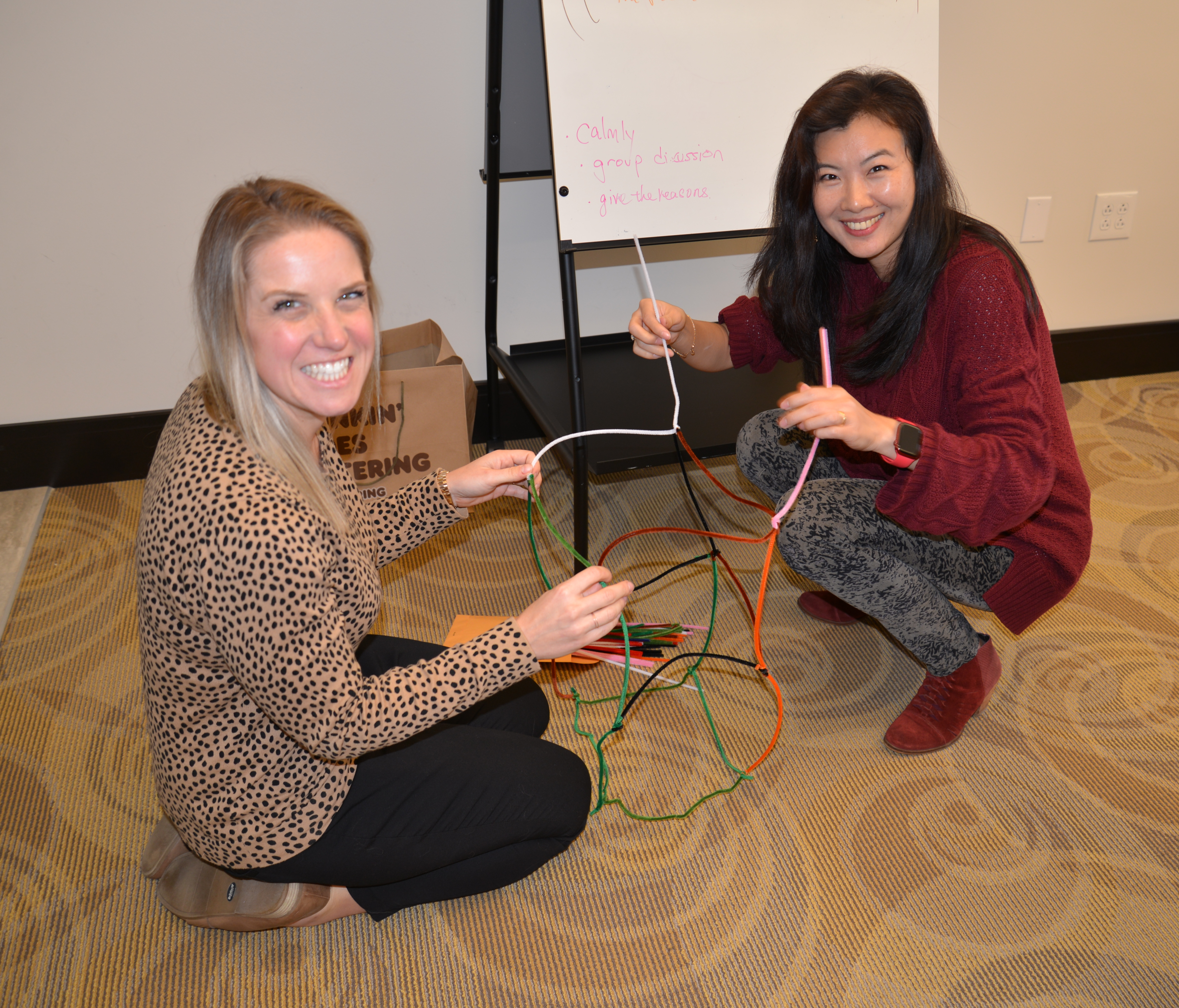 Staci M and Chelsey F doing teambuilding exercises