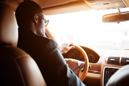 Man sitting in driver seat