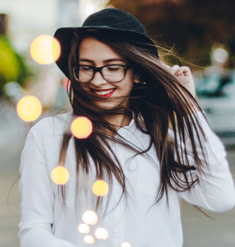 Woman in hat with windswept hair