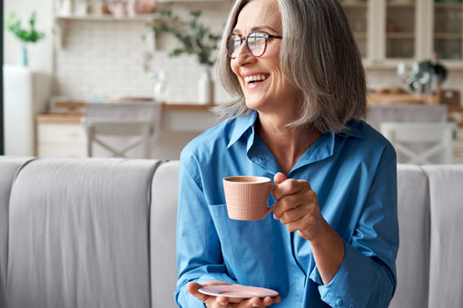 Older woman enjoying a hot drink
