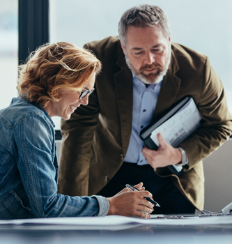 A man and woman discussing business finances