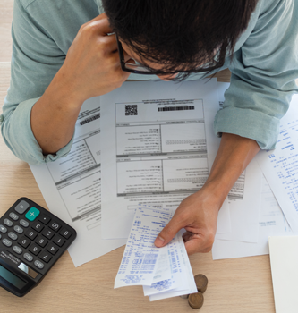 A man looking at his credit card statement.