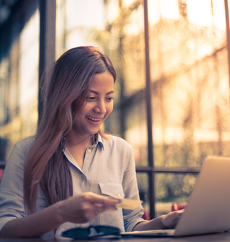 Young woman smiling at her computer