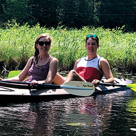 Member Alex kayaking in the summer.